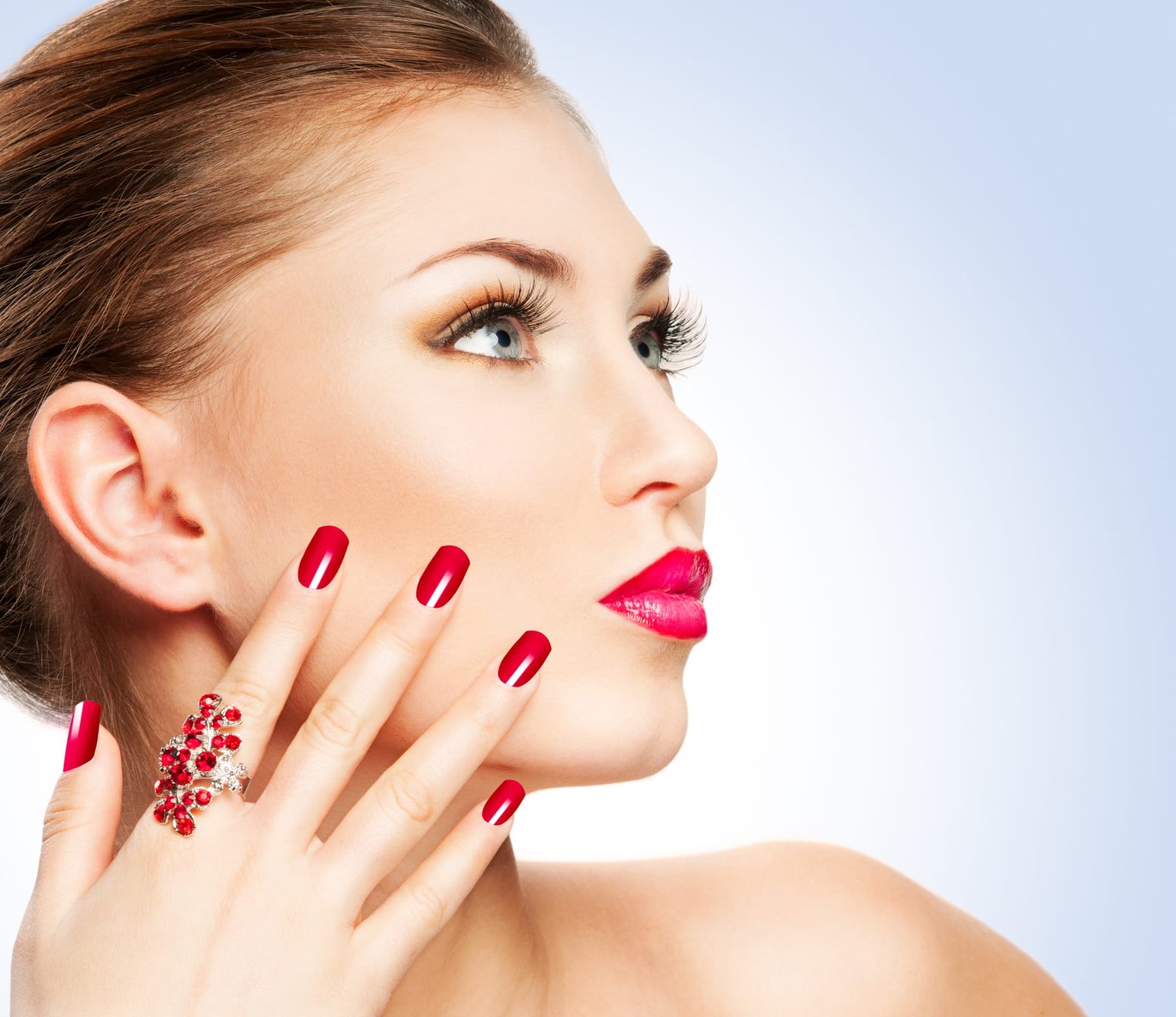 Beautiful woman showing perfect nails with healthy shine