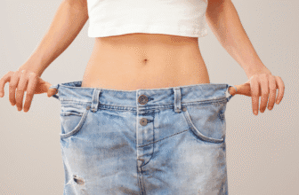 Woman wearing oversized pants after weight loss and wondering why cant I lose weight and how to achieve lasting results
