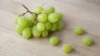 How many calories does a green grape have — bunch of fresh green grapes